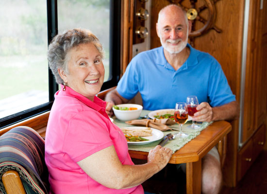 Happy couple enjoying motorhome