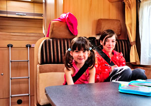 Children sitting in motorhome